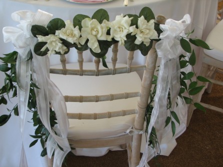 Bride's chair dressed in gardenias